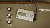 detail showing tuner connected to instrument